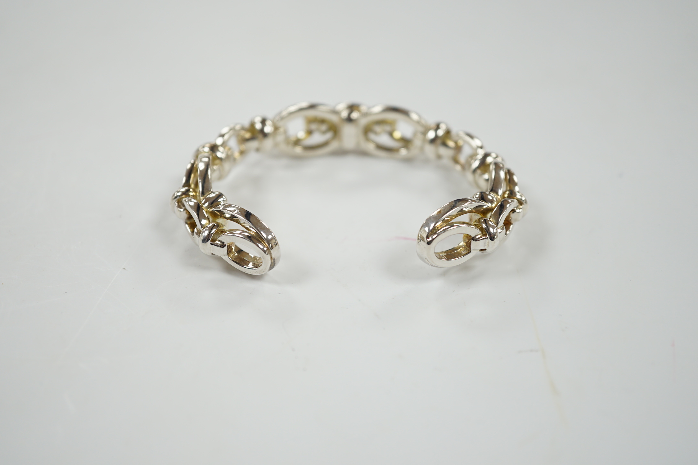 A modern Links of London silver oval link open work bangle, 60 grams, in Links of London box.